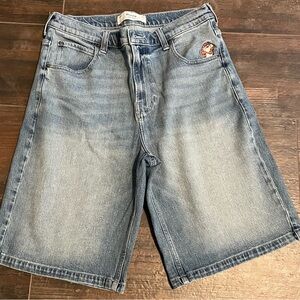 Hollister Light Blue Jean Shorts with Tasmanian devil coming out of the pocket..